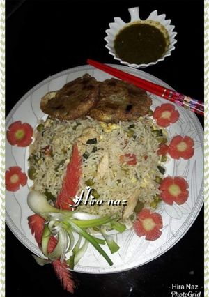 A picture of Chicken fried rice with shami kabab.