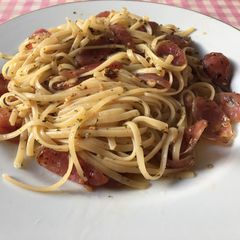 Fettucine aglio olio e peperoncino with sweet pork sausage A picture of Fettucine aglio olio e peperoncino with sweet pork sausage.