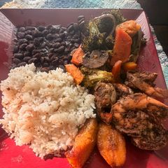 A picture of Jerk Shrimp with Coconut Rice and Baked Veggies.