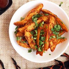 A picture of Spicy Potato Wedges Recipe | How To Make Indian Style Spicy Potato Wedges.