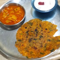 A picture of Methi thepla with strawberry elaichi shrikhand and potato sabji ka.