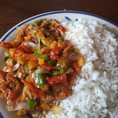 A picture of White rice and pepper sauce.