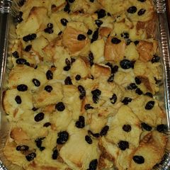 A picture of Classic NOLA Bread Pudding with Bourbon Sauce.
