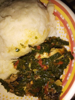 A picture of Efo riro soup with semo.