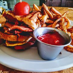 A picture of Pork Belly BLT with Hand Cut Frites.
