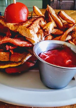 A picture of Pork Belly BLT with Hand Cut Frites.