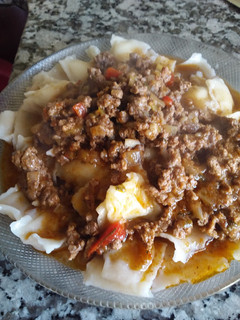 Una foto de Ravioles con salsa boloñesa A mi estilo