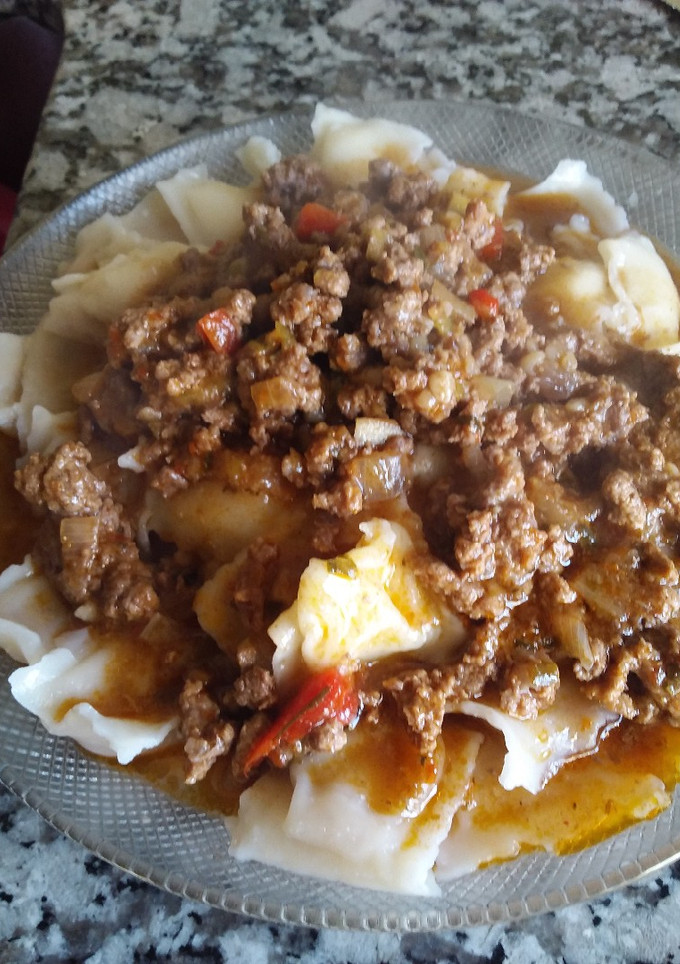 Una foto de Ravioles con salsa boloñesa A mi estilo