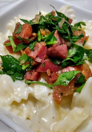 A picture of Parmesan bow-ties with crispy pancetta.