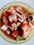 Ceviche de camarón con merluza de pescado y palmitos de cangrejo
