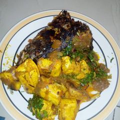 A picture of Unripe plantain with fish.