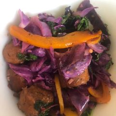 A picture of Sautéed Purple Cabbage & Kale with Hot Italian Vegan Sausage & Bell Peppers.