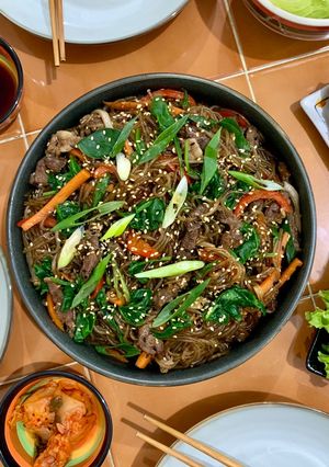 A picture of Japchae (Stir-fried Korean glass noodles).