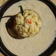 A picture of Aloo posto (Potato in poppy seed paste).