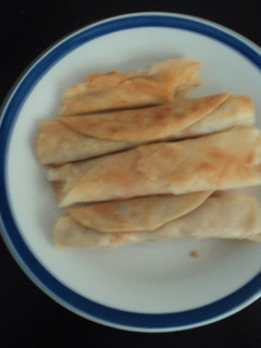 Una foto de Tacos de pechuga deshebrada fritos