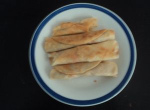 Una foto de Tacos de pechuga deshebrada fritos