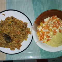 A picture of Fried rice with salad.