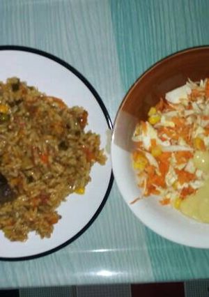 A picture of Fried rice with salad.