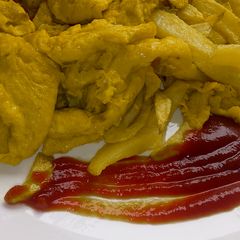 A picture of Fried chips and eggs.