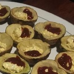A picture of Stuffed jacket potatoes with agg mayo and ketchup.