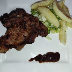 A picture of Rib Eye Beef Steak in Barbecue Sauce.
