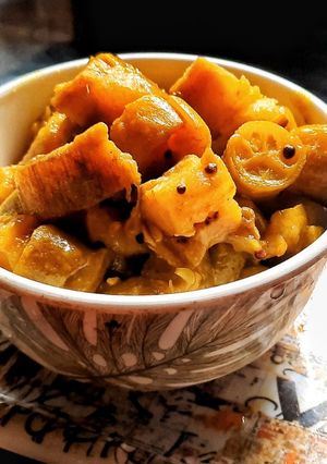 A picture of Raw bannana and ivy gourd dry gravy.