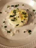 Poached eggs with cut spinach and onions