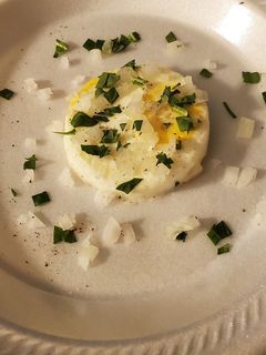 A picture of Poached eggs with cut spinach and onions.