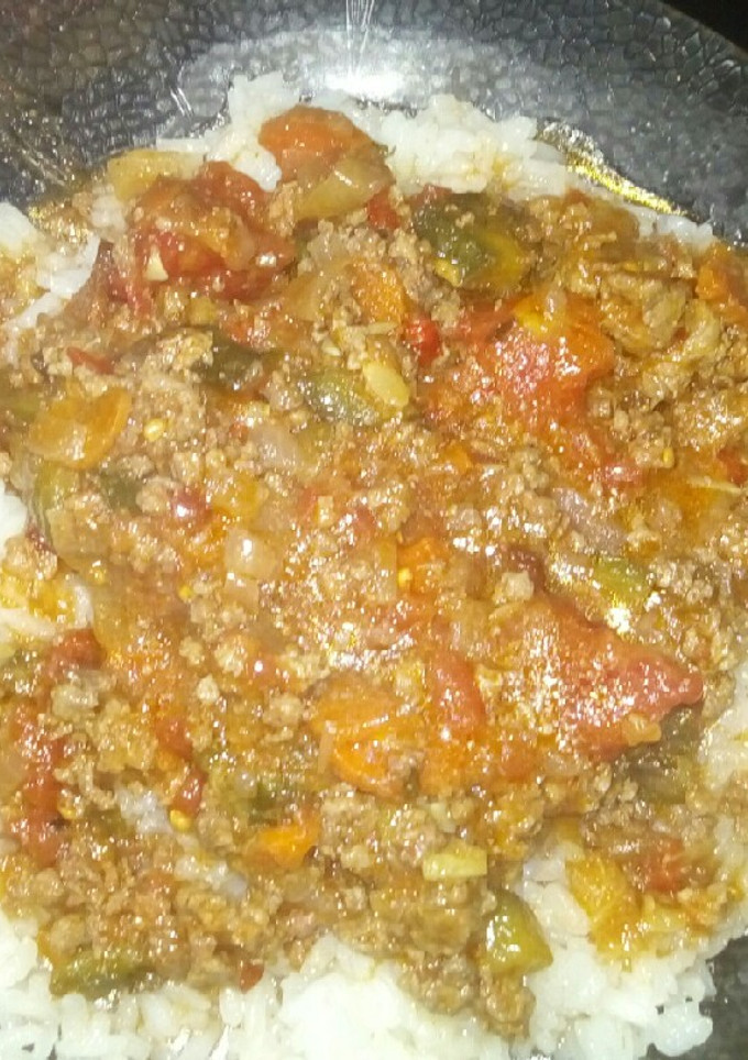 Una foto de Arroz con tuco y salsa de tomates