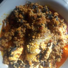 Egusi soup garnished with bitterleaf A picture of Egusi soup garnished with bitterleaf.