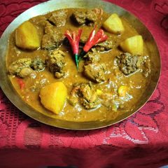 A picture of Tomato Chicken Curry.