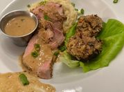 A picture of pork tenderloin with mustard sauce