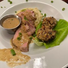 A picture of Pork Tenderloin with Spicy Mustard Horseradish Sauce.