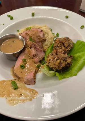 A picture of Pork Tenderloin with Spicy Mustard Horseradish Sauce.