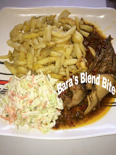 A picture of Peppered soup Chips and Salad.