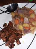 Arrowroots potatoes stew with dry fried pork