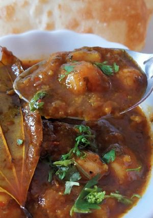A picture of Chole in brown gravy.