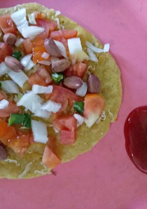 A picture of Besan peanuts beans pizza.