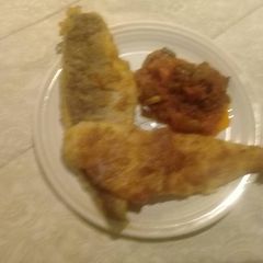 A picture of Fried fish with relish.