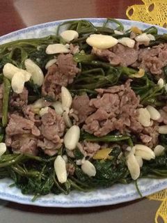 A picture of Stir-fried Buffalo Meat with Water Spinach.