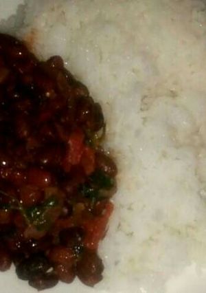 A picture of Bolied rice served with beans.