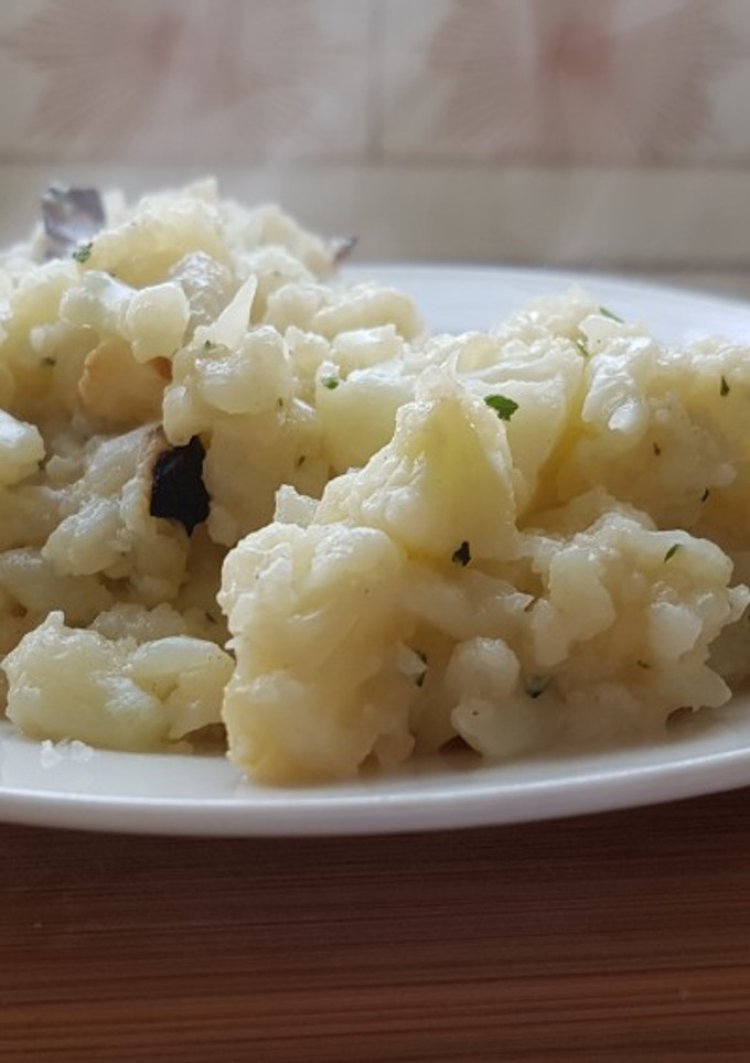 Una foto de Coliflor con ajo y perejil