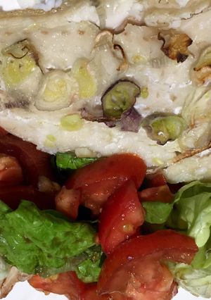 Una foto de Merluza al horno con cebolla