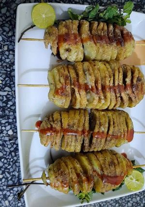 A picture of Red spicy Potato 🥔 spiral sticks.