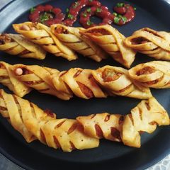 A picture of Striped Samose (Samose with Potato and peanuts filling).