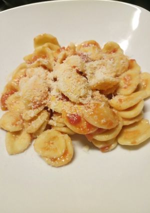 A picture of Fresh pasta with tomato and pecorino.