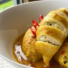 A picture of Squid Curry Stuffed with Tofu and Egg.