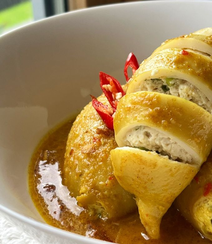 A picture of Squid Curry Stuffed with Tofu and Egg.