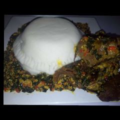 A picture of Efo elegusi served with pounded yam.