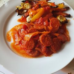 A picture of Chorizo and tomatoes.